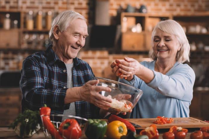 Older Couple Cooking with a Healthy Salt Alternative | Boulder Salt