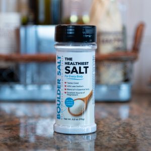 6 oz refillable shaker of Boulder Salt on a kitchen counter, showcasing the balanced electrolyte blend