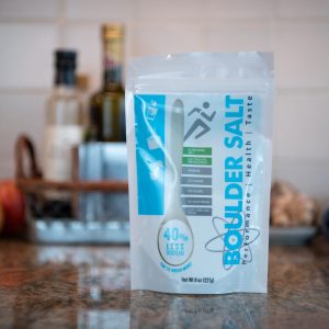 Boulder Salt 8oz resealable bag on a kitchen counter - a heart-healthy Multi-Salt for hydration and seasoning.